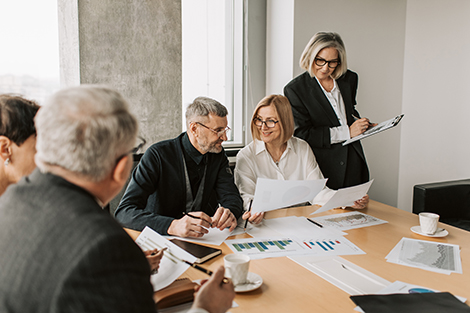 One way of managing hearing loss at work is by letting a speaker know about your communication preferences before a meeting starts.