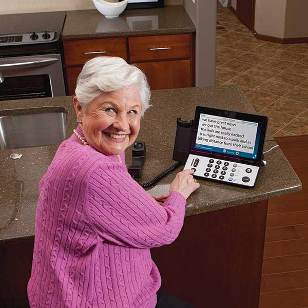 A captioned telephone in a senior living community helps residents stay engaged with loved ones.