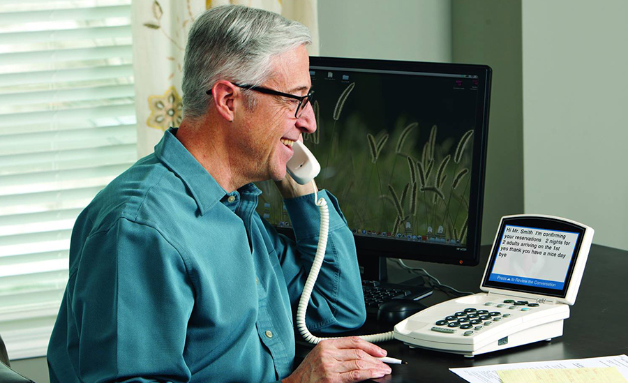 Captioned telephone with hearing aid compatibility