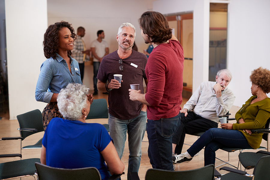 A diverse group of individuals sitting in a circle