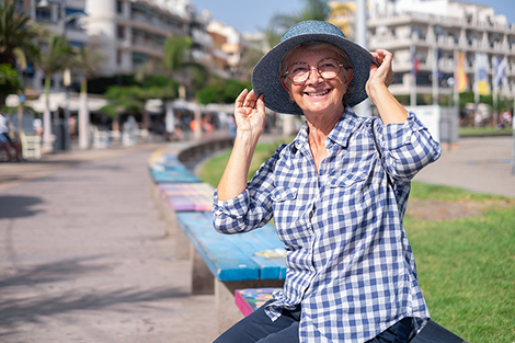 A person applying sunscreen to protect their skin from harmful UV rays.