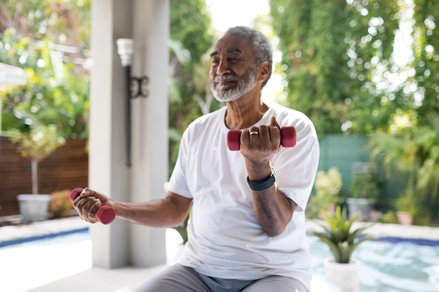 Senior man doing exercises to improve fitness and mobility.