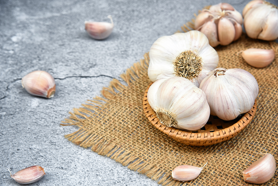 A close-up image of fresh garlic cloves