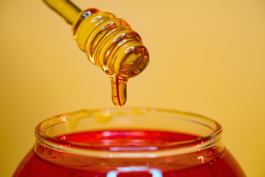 A close-up image of a jar of honey