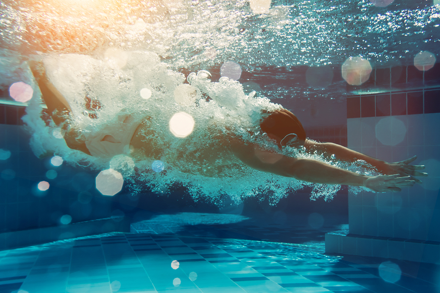 A person swimming in a pool