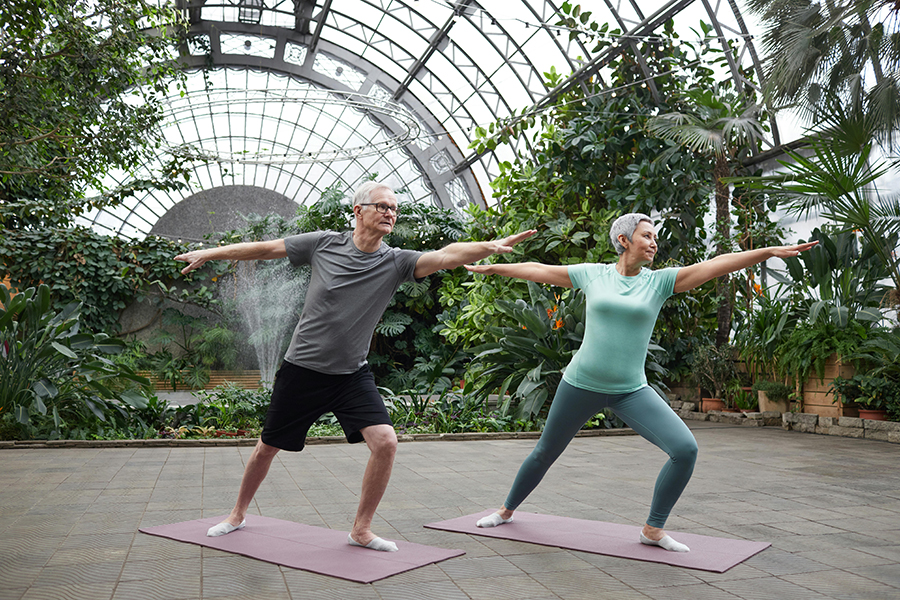 A person practicing Tai Chi outdoors to improve their health and fitness through gentle exercise.