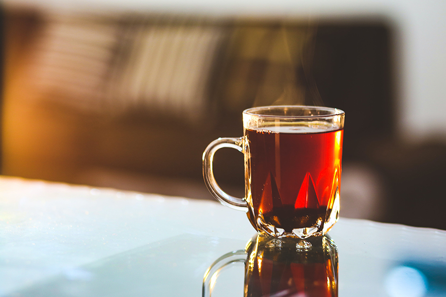 A cup of tea with lemon and honey