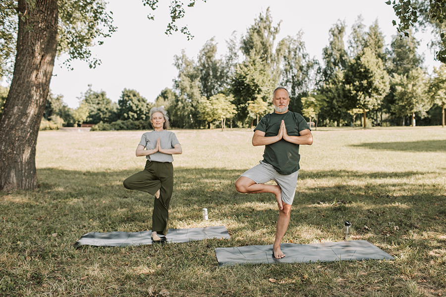 Image of older adults practicing yoga to improve their health and fitness.