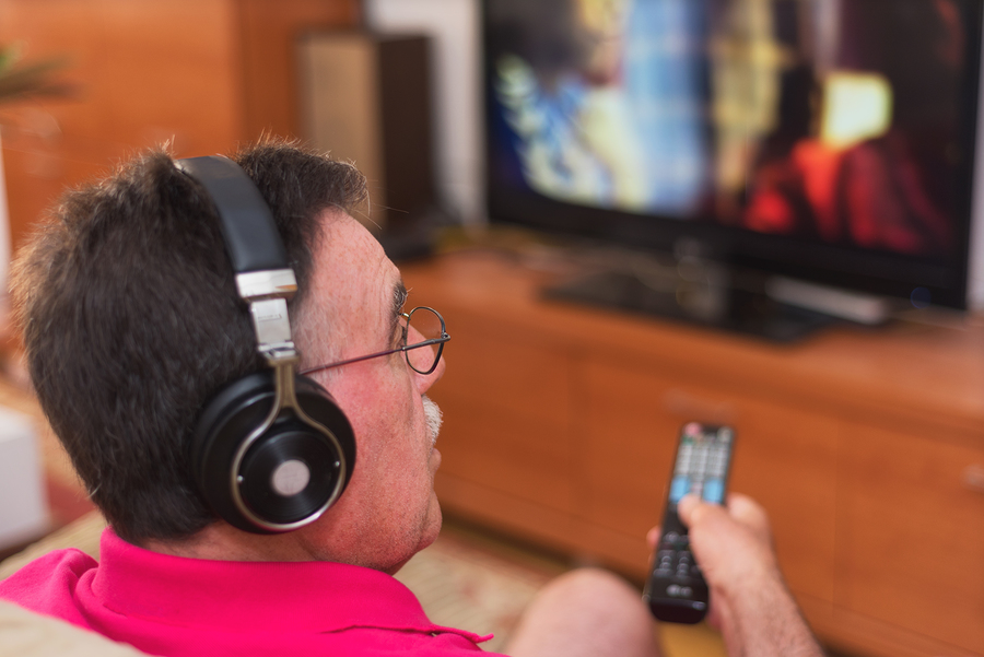 A person with hearing loss can benefit from TV accessories and assistive technology to improve their viewing experience. These devices can help amplify sound