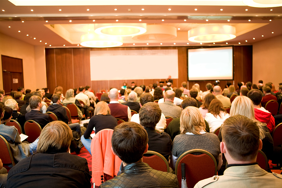 A diverse group of people attending a hearing loss awareness event in 2021.