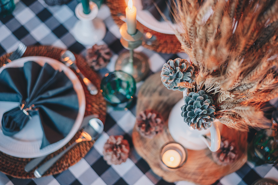 A beautifully decorated Thanksgiving table with homemade decorations and a DIY centerpiece