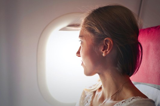 Image of a person experiencing ear pressure during air travel