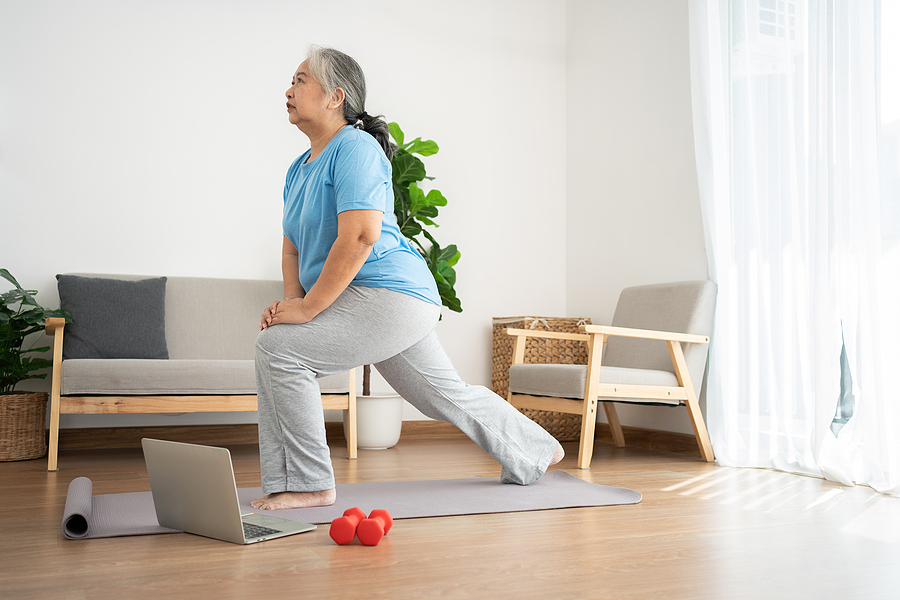 A person doing morning stretches to start their day with a stretching routine.