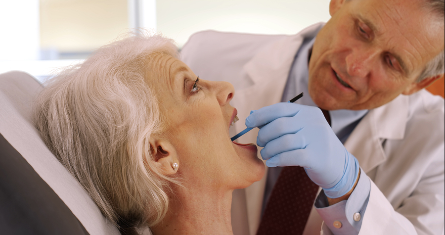 Image of a senior brushing their teeth