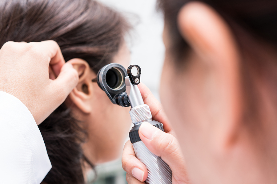 A person receiving an annual hearing test to prevent hearing loss and maintain good hearing health.