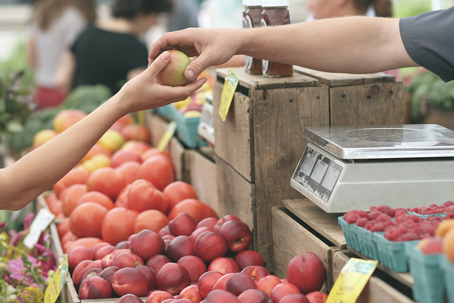 A variety of fall produce at a farmers market