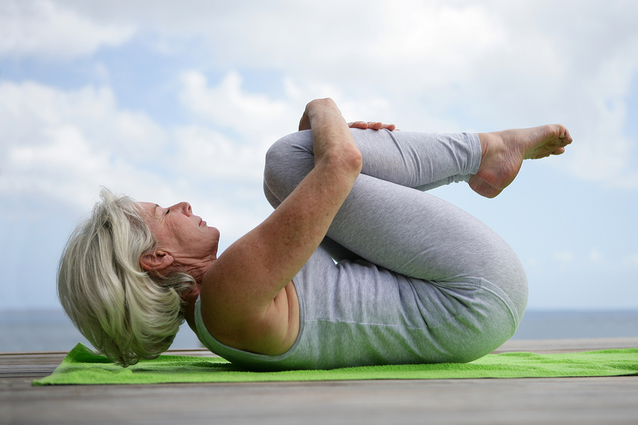 Image of a senior practicing relaxation techniques for stress relief.