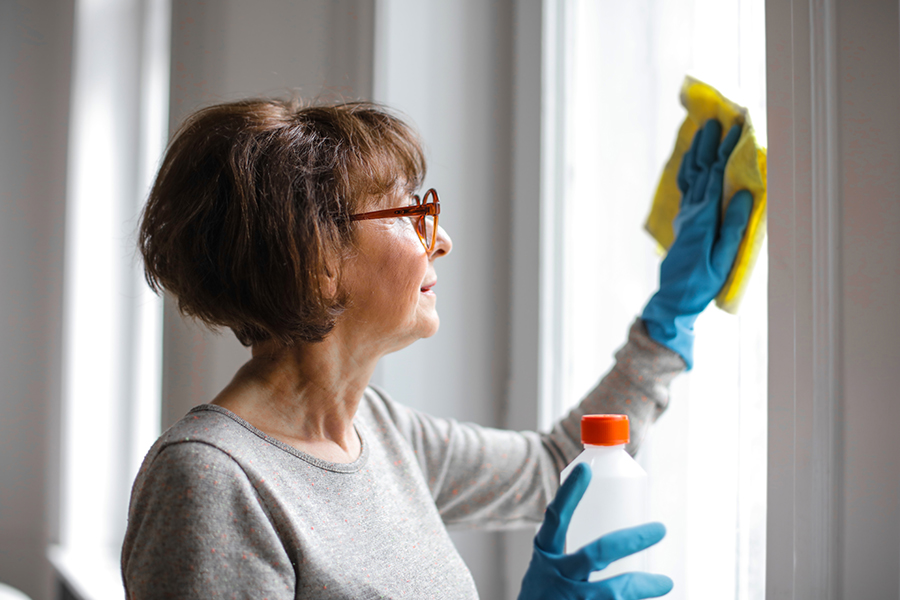 A person organizing their home during spring cleaning