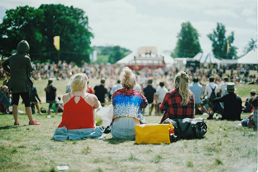 Image of a sign at a music festival promoting accessibility for individuals with hearing loss.