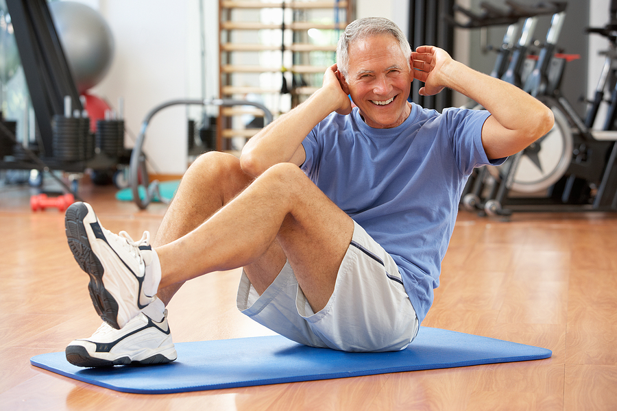 Image of person wearing hearing protection while exercising to promote exercise safety and protect ear health.