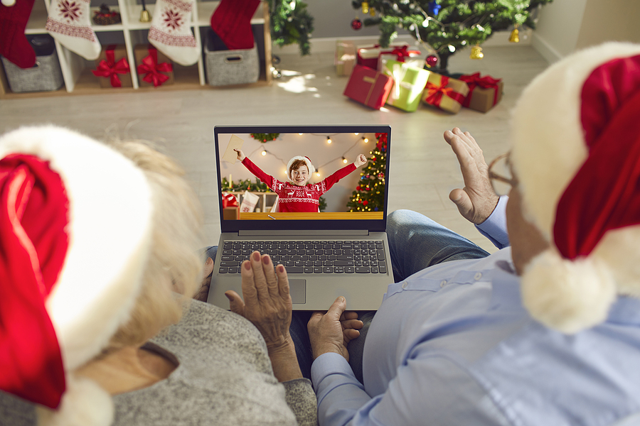 A group of grandparents and grandchildren laughing and playing together