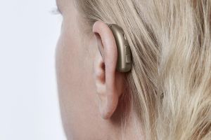 A person with hearing loss can benefit from telecoil technology